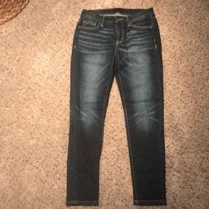 Buckle black skinny jeans